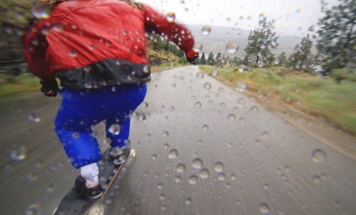 What are the safety tips to follow while long-boarding in the Rain